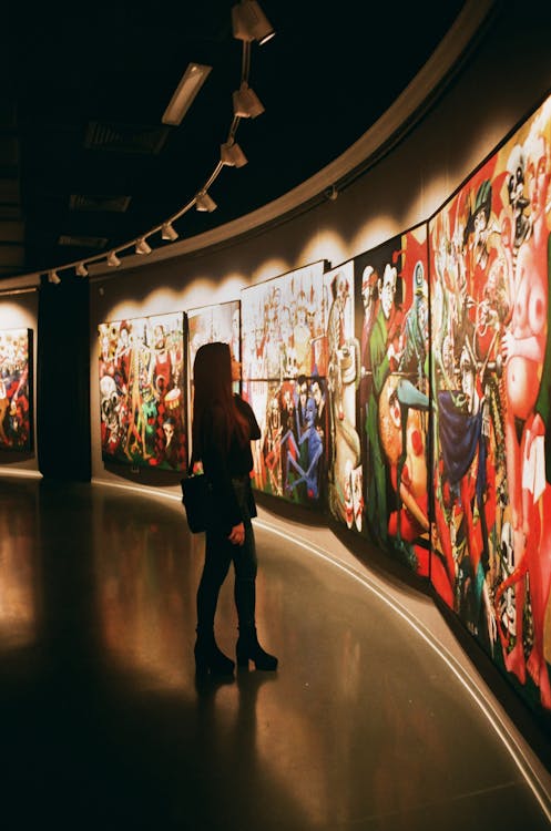 girl at museum looking at art. affordable art
