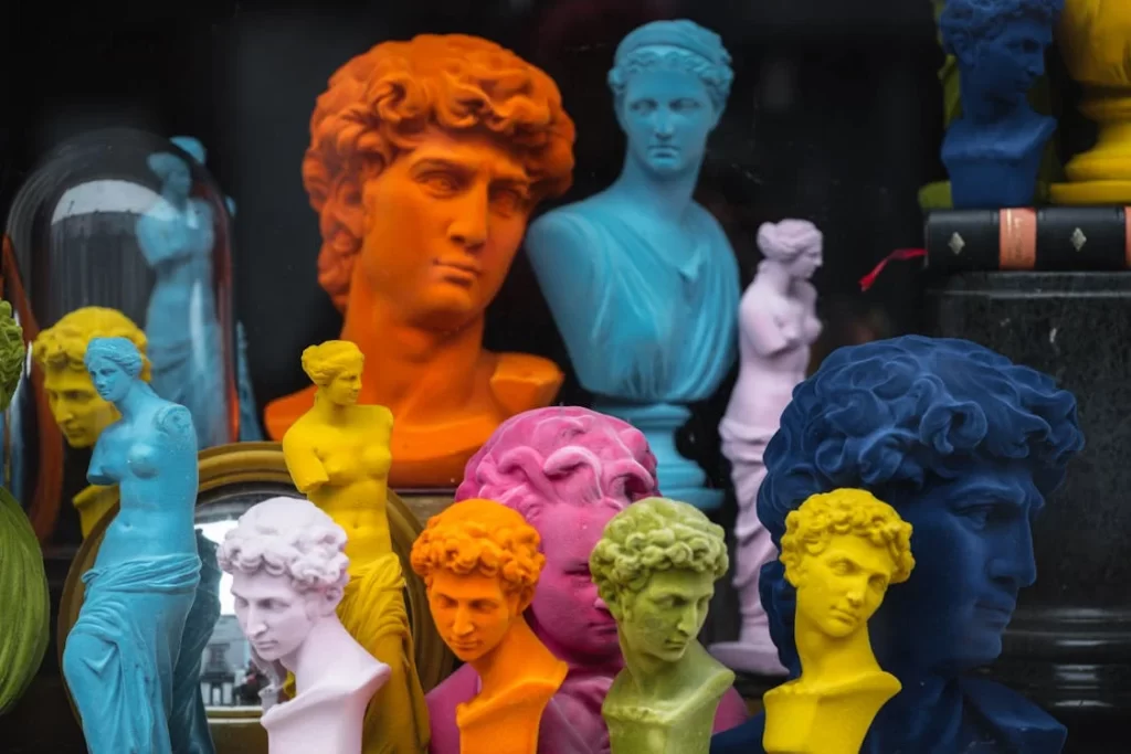 A group of sculpted heads in various colors